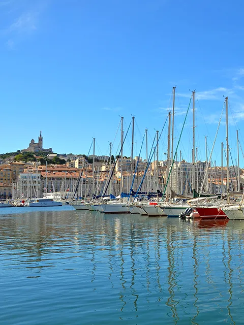 Admire Notre-Dame from the Vieux-Port during a day trip to Marseille